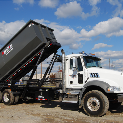 A Large Truck Parked On The Side Of A Road